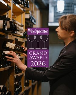 Sommelier selecting wine bottles in a cellar at Daniel, a Michelin-starred French fine dining restaurant.