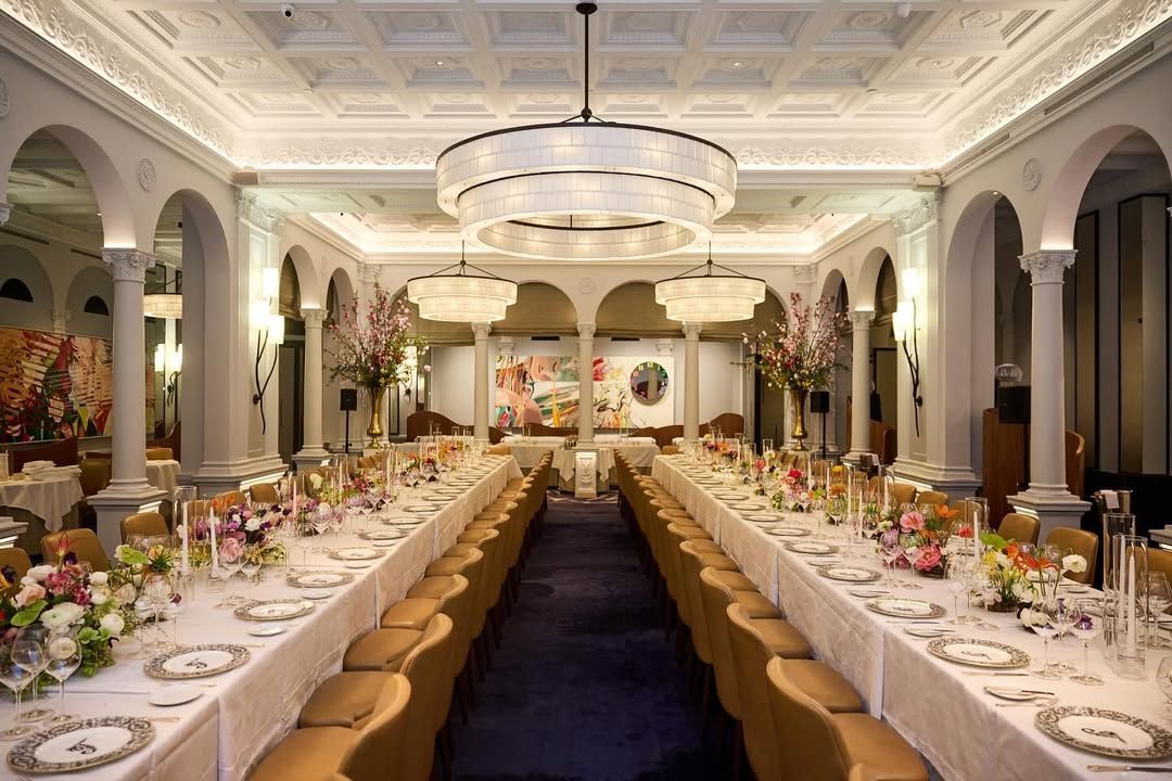 Elegant dining room at Daniel, featuring lavish floral arrangements and sophisticated table settings for fine dining.
